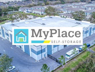 Aerial view of a MyPlace Self-Storage facility with blue and white storage units and parking areas.
