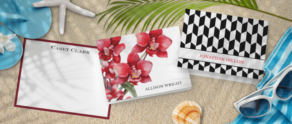 Beach flat lay with three book covers (Casey Clark, Allison Wright, Jonathan Dillon) on sand, paired with a blue flip-flop, shell, palm leaf, and sunglasses.
